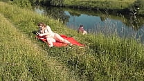 Naked in public. Public nudity. Nudist beach. in the event that Wild beach. MILF sunbathing naked near fisherman